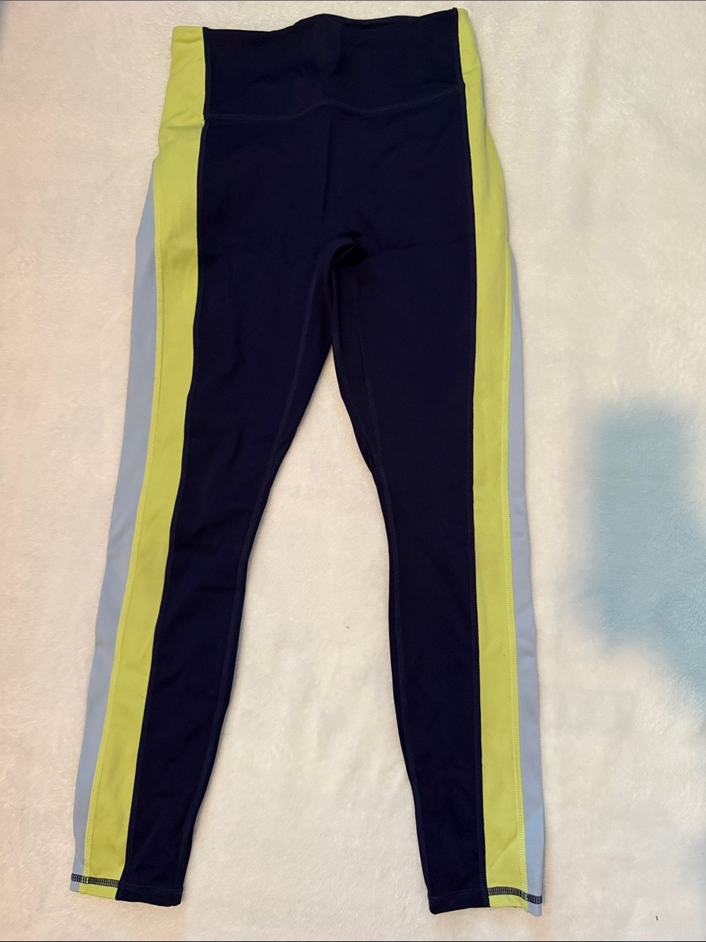 Woman’s fabletics navy Leggings with Lime Side Stripes. No tag but fits like a S